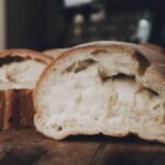 Close-up of sliced rustic bread showcasing texture and golden crust.